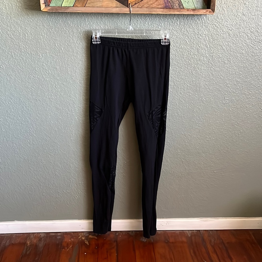 Black leggings with lace cutouts